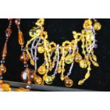Boruni amber and amethyst bead tassel necklace, the tassels formed of suspended amber and amethyst