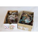 Two shoe boxes of assorted vintage costume jewellery to include necklaces, bangles, bracelets, beads