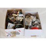 Two shoe boxes of vintage costume jewellery to include bangles, brooches, rings, necklaces,