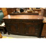 Mid 20th century Oak Jacobean Style Sideboard, the three drawers with thumbnail style carving over