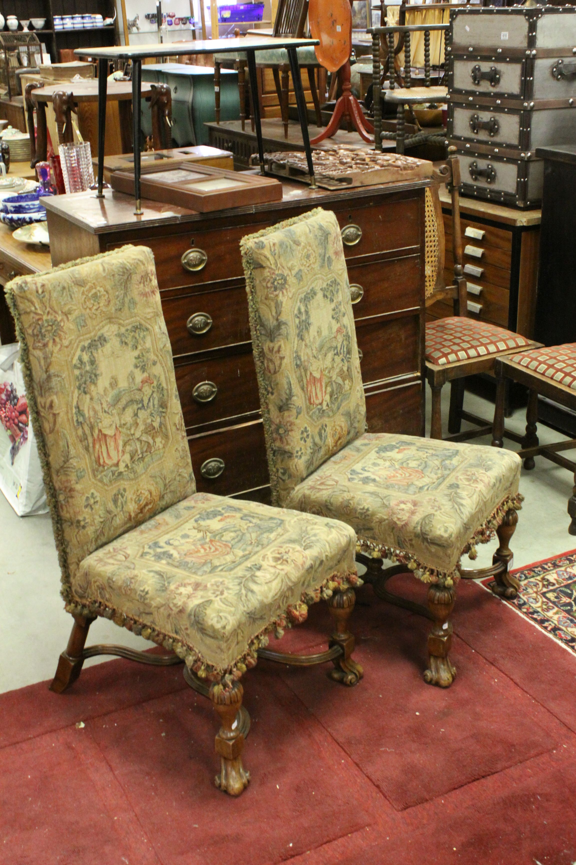 Pair of 17th century Style Chairs, the needlework covered seat and back with fringes and tassles