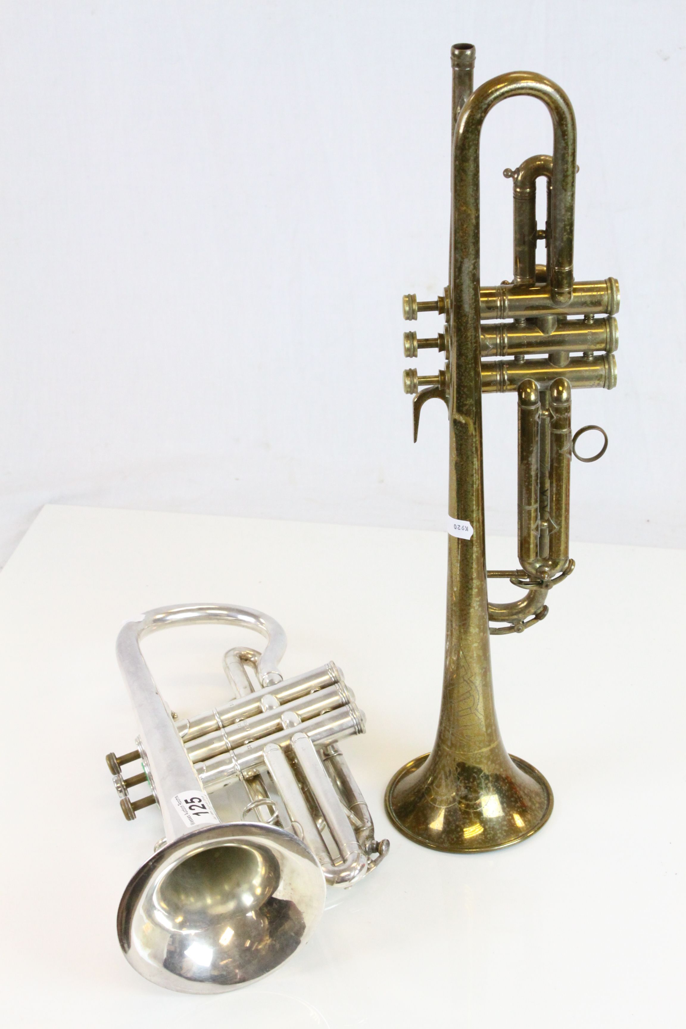 Two vintage Trumpets to include a Brass one marked "Manhattan" and a Silver plated example marked "