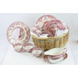 Wicker basket containing a part set of Johnson Brothers ceramic dinnerware in "Old Britain