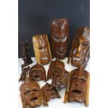 Collection of approximately Nine African Ethnic Wooden Carved Face Masks and other items