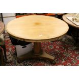 19th century Mahogany Tilt Top Circular Centre Table raised on octagonal pillar support and platform