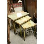 Onyx and Gilt Metal Nest of Three Tables, all on castors