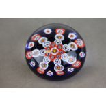 Liskeard Glass paperweight with 2D millefiori style decoration, stamped to base together with a
