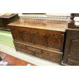 18th century Oak Coffer with hinged lift lid, four arched panel front above a bank of three short