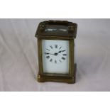 French brass carriage clock, white enamel dial with black Roman numerals and black poker hands,