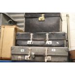 Three vintage suitcases and one other