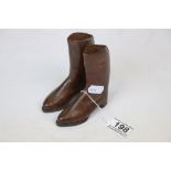 A pair of handmade miniature brown leather cowboy shop display boots, punched decoration, height