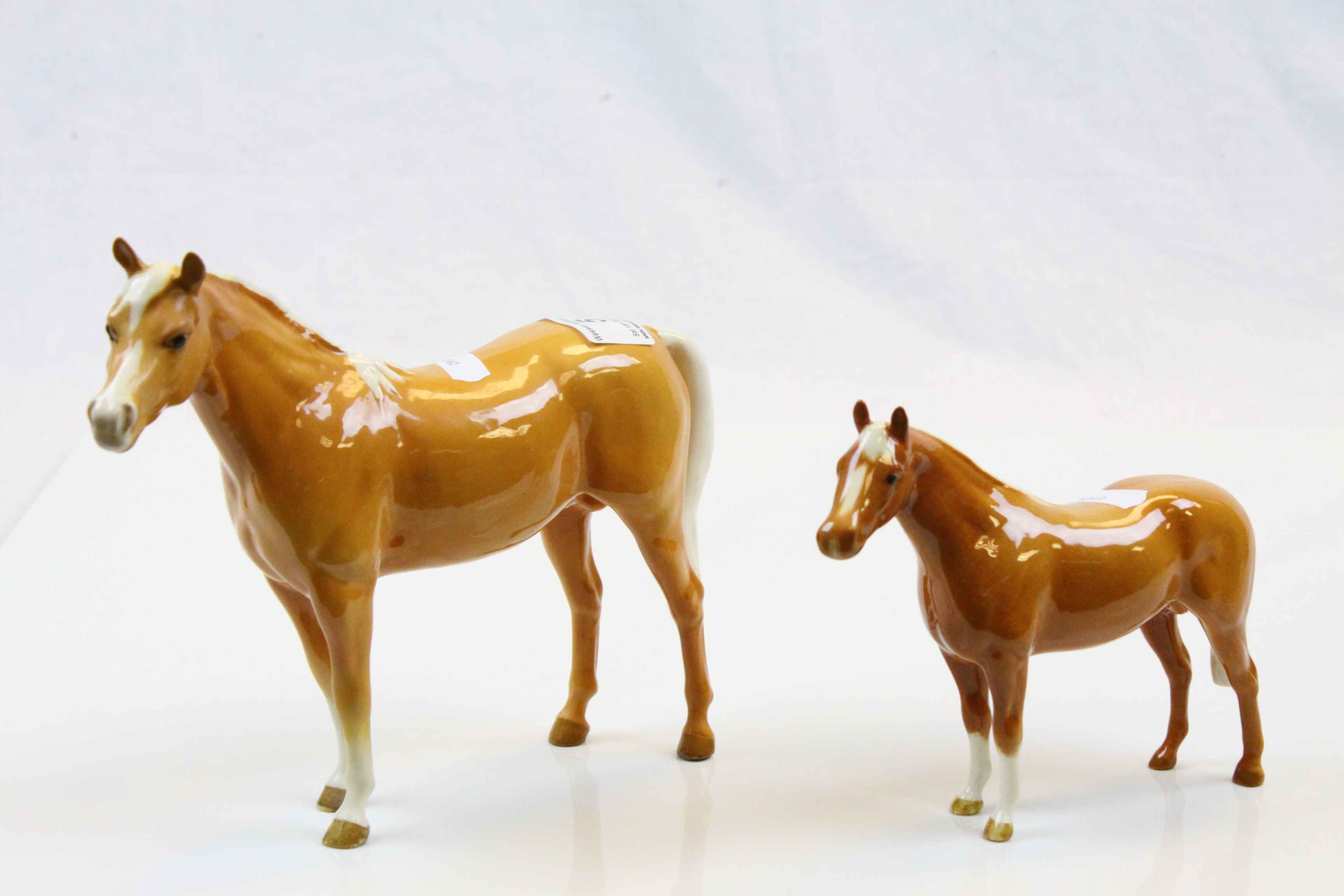 Two Beswick Palomino Horses of different sizes