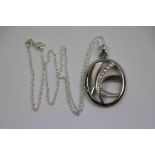 Large silver oval pendant set with cz