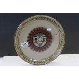 Mexican Studio Pottery charger with Face in Sun design and marked to reverse "Hand Painted in Mexico