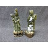 Two carved hardstone jade type Oriental figurines, one depicting a woman holding a lotus flower,