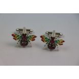 Pair of silver piquet a jour cufflinks in the form of bees set with rubies