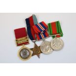 A Group Of Four Medals To Include Three Full Size World War Two Medals Being The British War