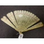 19th century Chinese carved ivory fan, the sticks forms of finely carved ivory panels depicting