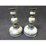 A pair of 19th century Continental enamel and white metal candlesticks of knopped form, floral and