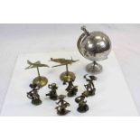 A brass model of Concorde similar spitfire a metal globe and children pirates.