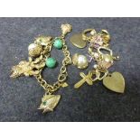 Two costume jewellery yellow metal charm bracelets, assorted charms (2)