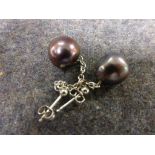 Pair of silver drop earrings set with large baroque grey freshwater pearls