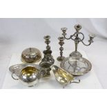 Box of silver plate to include gravy boat, sugar bowl, milk jug, muffin dish, pair of candlesticks