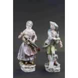 Pair of 19th Century ceramic figures with Musical intstruments with Meissen type blue crossed