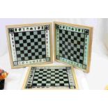 three framed chess game boards.