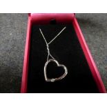 9ct white gold heart shaped pendant set with a diamond on white gold chain