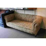 Late Victorian Scroll End Chesterfield Sofa raised on bun feet and castors, approximately 202cms