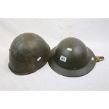 Two Military Helmets Both Complete With Straps And Liners.