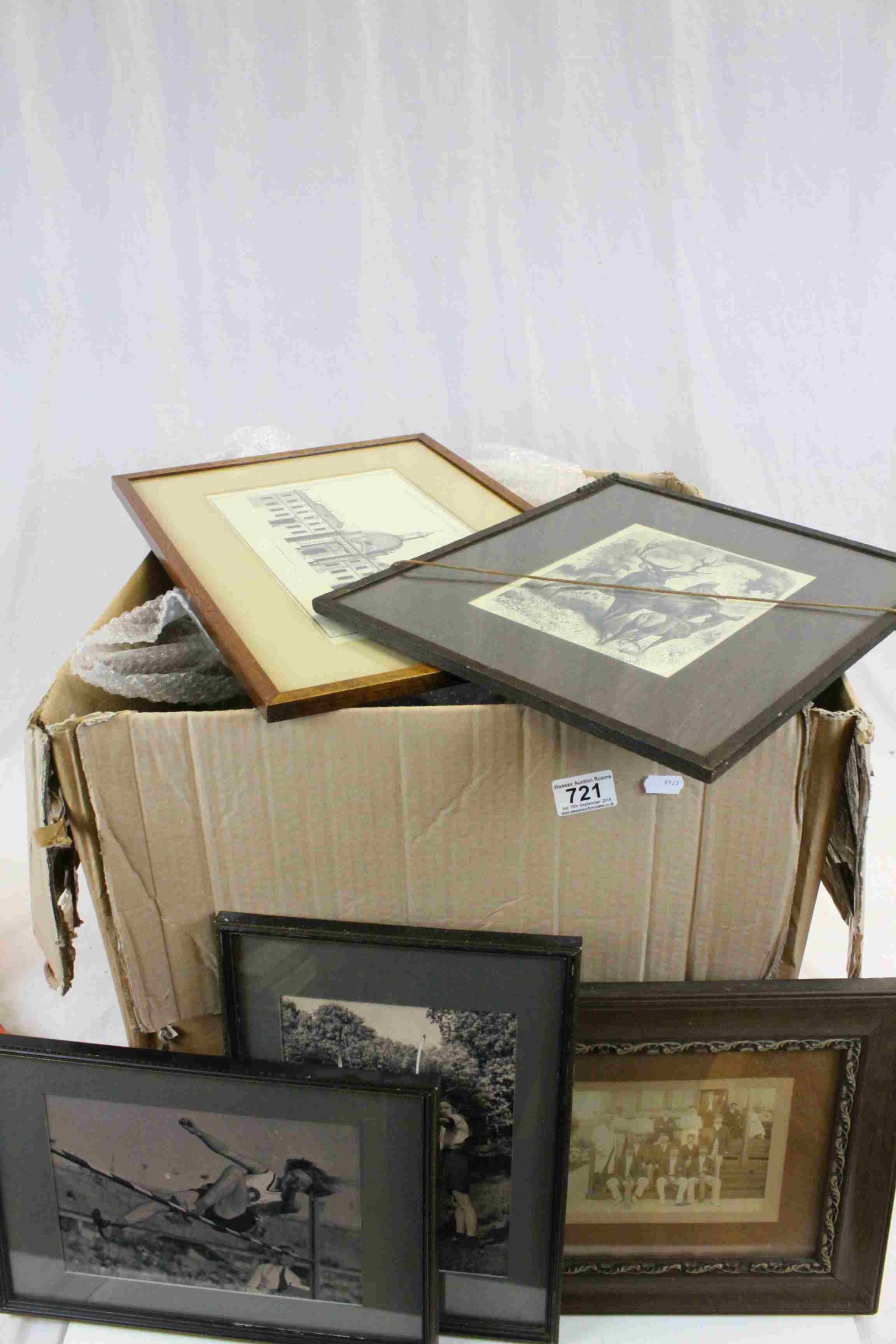 A quantity of framed prints and images.