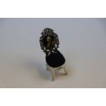 Miniature silver chair pin cushion with enamel picture of an elderly lady sewing