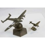 Brass model of a Spitfire and a larger Silvered Brass model of a Bomber Aircraft