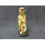 19th century Japanese ivory figure of a clocked woman and dog, inked hair, dog and parasol, together