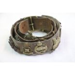 A Military Belt With A Collection Of Approx 20 x Military Cap To Include The York & Lancaster