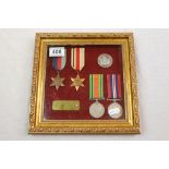 A World War Two Framed Full Size Medal Group To Include The British War Medal, The Defence Medal,