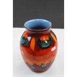 Poole Pottery vase in bright Orange & Red colours and pale Blue interior