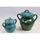 Two Persian Cyan Glazed Lidded Pots with Rope Twisted Handled, 35cms high and 26cms high