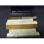 Collection of vintage technical drawing and measuring instruments to include slide rules