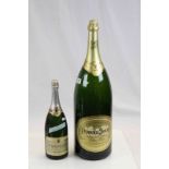 Two Champagne Display bottles to include a large example marked "Perrier Jouet", the smaller one