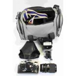 Olympus OM10 Camera together with Various Lenses and Accessories contained in a Soft Camera Bag