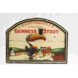 Wooden advertising sign for "Guinness Stout at Seamus O Donnell's"