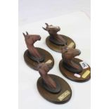 Four Beswick Racehorse Head busts on wooden mounts to include; Troy, Arkle, The Minstrel & Red Rum