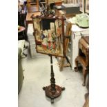 Early 19th century Rosewood Pole Screen on Pedestal Feet, the tapestry panel depicting an old