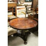 Mid 19th century Mahogany Circular Top Tilt Top Table raised on Octagonal Pillar Supports on a