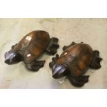 Pair of of carved wooden tortoises.