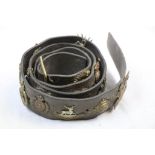 A Military Belt With A Collection Of Approx 20 x Military Cap To Include The Border Regiment, The