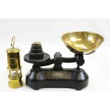A set of vintage scales and weights and a reproduction miners lamp.